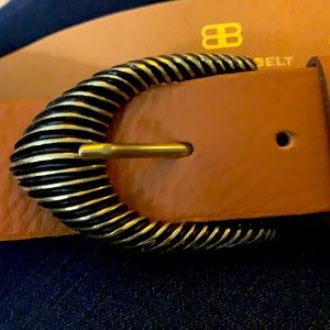 Below the belt brown M